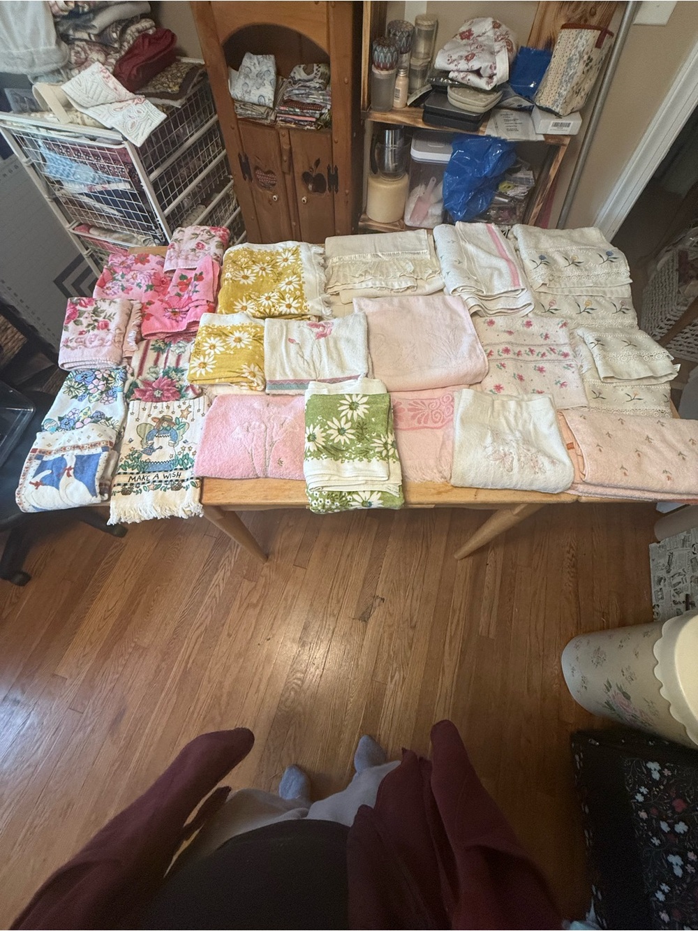These are a collection of vintage linens and floral patterned bath towels.